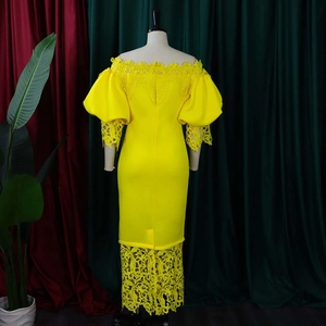 Rear view of yellow off-shoulder dress featuring intricate lace details and lantern sleeves