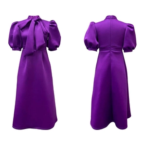 Front and back view of purple satin evening dress with bow detail and puff sleeves