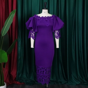 Detailed view of the off-the-shoulder lace neckline and puff sleeves on a dark purple gown
