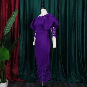 Detailed view of purple lace stitching and dramatic bubble sleeves on the fitted dress
