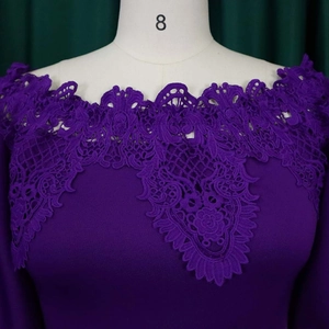 Close-up of elegant purple lace patchwork on the off-shoulder neckline and lantern sleeves