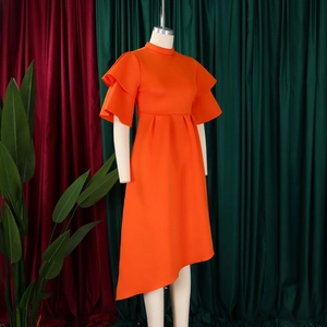 Close-up of double-layered ruffle sleeves and high neckline on orange summer dress