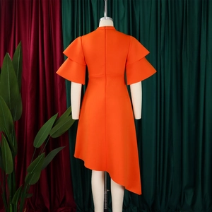 Detail of double-layer ruffle sleeves and back zipper on bright orange midi dress