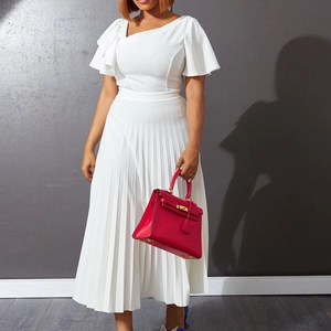Detailed view of the pleated texture and ruffled short sleeve on the white waist dress