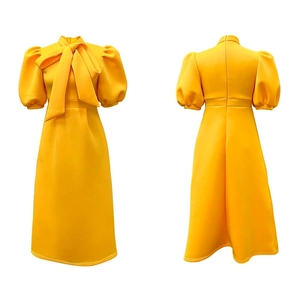 Detailed front and back view of a yellow puff sleeve dress with a large bow neckline
