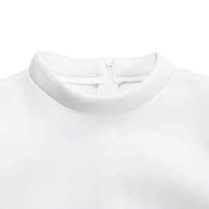 Close-up of white summer dress featuring high collar and hidden back zipper detail