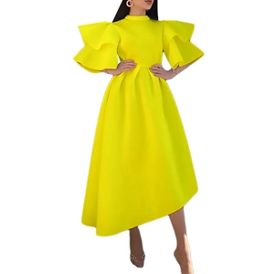 Detail of elegant bright yellow dress featuring double-layer ruffle sleeves and high neckline