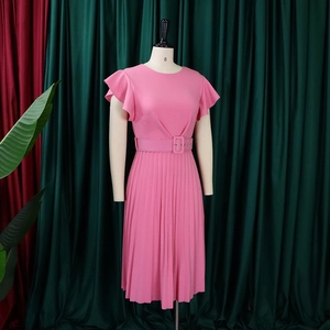 Detailed view of pink pleated dress with ruffle sleeves and matching square buckle belt