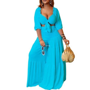 Summer two-piece set featuring cyan V-neck crop top and high-waisted wide-leg trousers