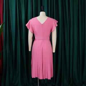 Detailed back view of a pink pleated dress featuring a V-neck and ruffle cap sleeves