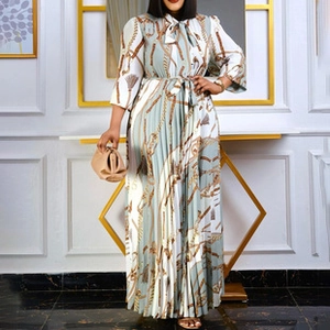 Detail of the chain print pattern and fine pleats on this elegant long-sleeved dress