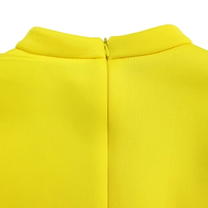 Detail of yellow dress featuring a stand-up collar and high-quality back invisible zipper
