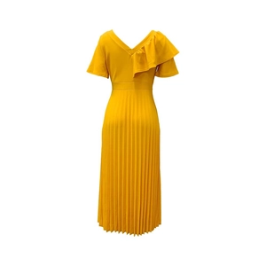 Detail of yellow pleated dress featuring V-neckline and elegant ruffle sleeve design
