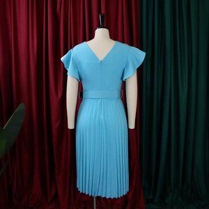 Detail view of light blue pleated midi dress featuring flutter sleeves and a matching belt