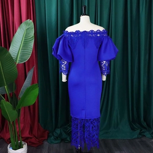 Detail of royal blue off-shoulder dress featuring intricate hollow lace trim and lantern sleeves