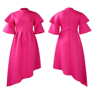 Detail of rose pink dress featuring layered ruffle sleeves and asymmetric high-low hemline