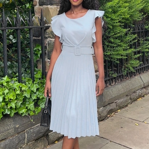 Light blue pleated midi dress with ruffle sleeves and matching belt in outdoor setting