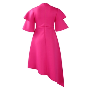 Detail view of hot pink dress back with layered ruffle sleeves and asymmetric hemline