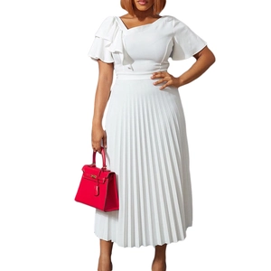 Detail of elegant white one-shoulder dress featuring tiered ruffle sleeve and pleated skirt