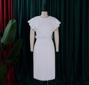 Close-up of white midi dress featuring pleated skirt details and adjustable waist belt