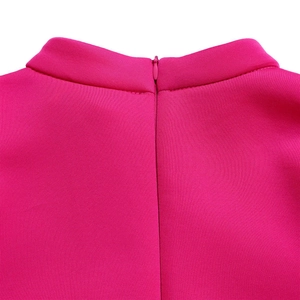 Detail of fuchsia dress back showing invisible zipper and textured fabric collar