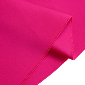 Detailed close-up of double-layer ruffle sleeves in magenta pink fabric with fine stitching