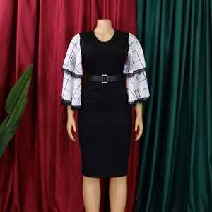 Detail of elegant V-neck pencil dress with white mesh floral bell sleeves and belted waist