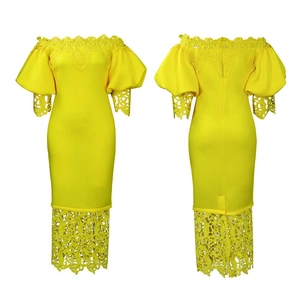 Detailed close-up of yellow off-shoulder dress featuring intricate lace sleeves and hem
