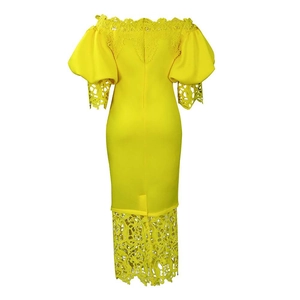 Detail of elegant yellow off-shoulder dress featuring intricate white lace patchwork on sleeves