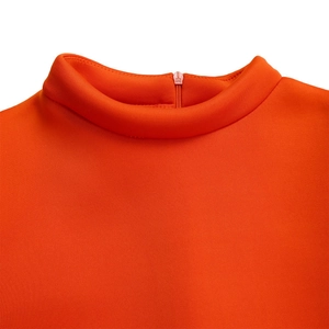 Detail view of the mock neck and back zipper closure on this vibrant orange summer dress