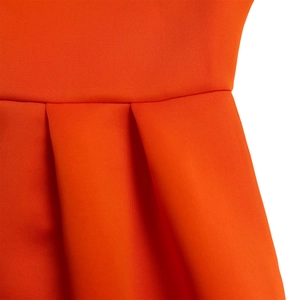 Detail of waist pleats and knit texture on this bright orange summer dress for women