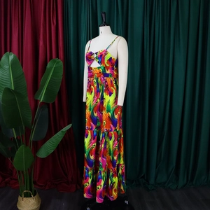 Detail of colorful abstract print tiered dress featuring a knotted cutout bust and thin straps