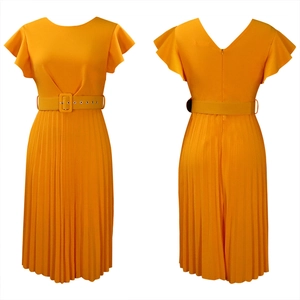 Detail view showing bright yellow pleated dress with ruffles and matching waist belt