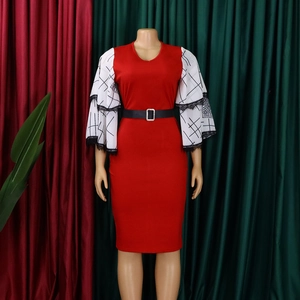 Detail of red pencil dress featuring black and white plaid bell sleeves with lace trim