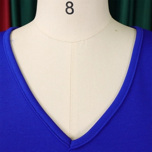 Close-up of V-neckline on dark blue dress with fine ribbed texture on a size 8 mannequin