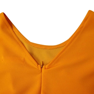 Detail view of round neckline and invisible back zipper on the orange pleated dress