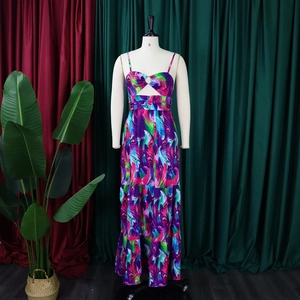 Detail of tropical feather print maxi dress with front metal ring and cut-out design