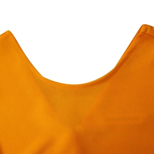 Detail of scoop neck and stitched seam on this vibrant orange summer pleated dress