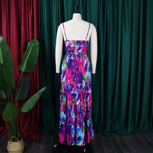 Detail of bohemian floral maxi dress back showing vibrant feather patterns and thin straps