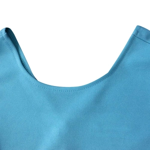 Detail of crew neckline and fine knit texture on a sky blue summer dress with neat stitching