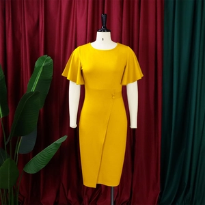 Detail of mustard yellow pencil dress with ruffle sleeves and buckled belt on mannequin