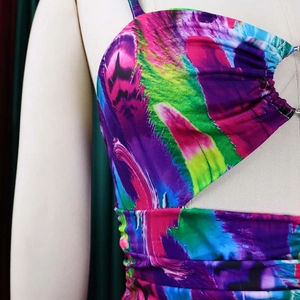 Detailed view of the vibrant floral print cutout and ruched bodice on the summer dress