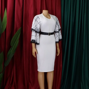 Detail of V-neck white midi pencil dress with lace flare sleeves and black belt