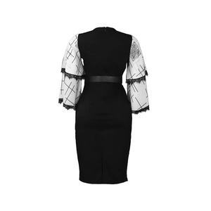 Detail view of the elegant lace ruffle cuffs and floral patterns on the pencil dress