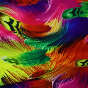 Close-up of vibrant digital print fabric featuring colorful feather patterns and textures