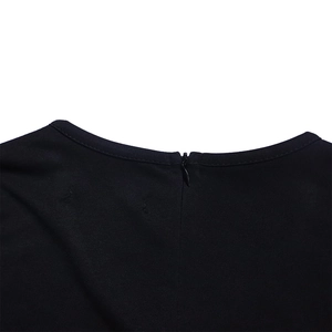Close-up detail of the concealed back zipper on a professional black V-neck pencil dress