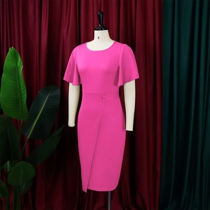 Detail of rose pink dress featuring ruffle sleeves, waist buttons, and tulip hemline