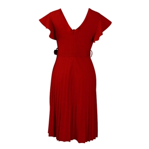 Detail of red pleated mini dress with ruffle sleeves and waist belt on white background