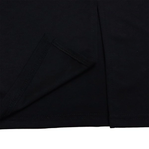 Detailed view of the clean side slit and double-needle stitching on the black pencil dress