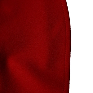 Macro detail of red pleated fabric texture with high-quality stitched hem and fine weave